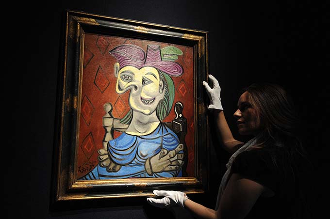 Picasso's Seated Woman in Blue Dress sells at Christie's in New York for $45m